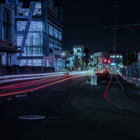 City street with light trails at night