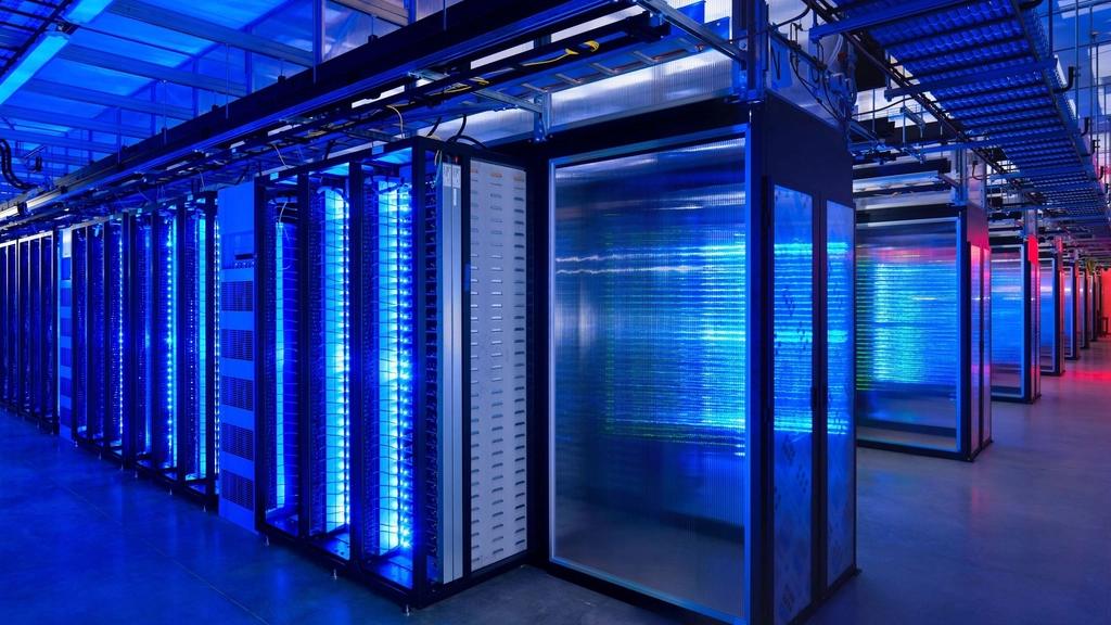 Rows of servers in a blue-lit data centre